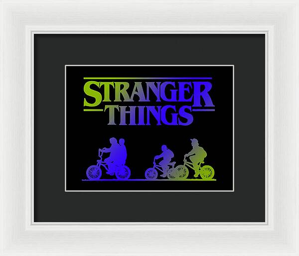 Framed Stranger Things print with neon kids on bikes, white frame and black mat