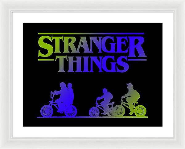 White-framed Stranger Things print with white mat, multicolor logo and bike silhouettes on dark background.
