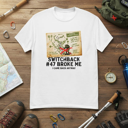 White hiking t-shirt laid flat with map graphic and red figure front print
