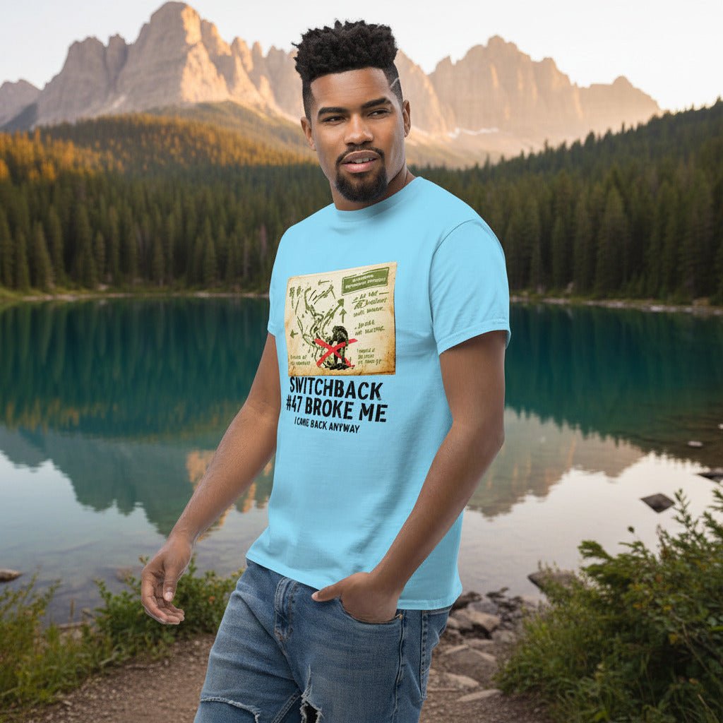 Light blue hiking T-shirt with front map-style graphic and “Switchback #47 Broke Me”