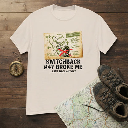 White hiking t-shirt with printed map graphic and red figure on the front