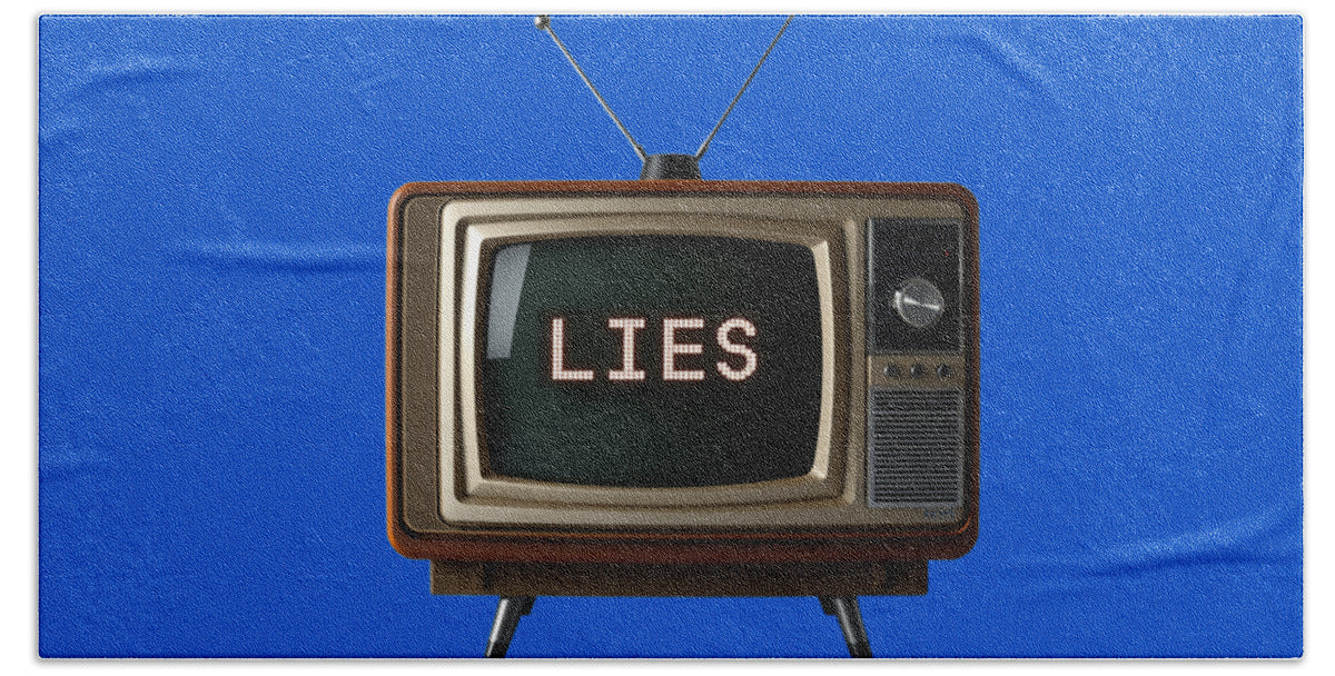 Blue beach towel featuring TV graphic with 'LIES' lettering