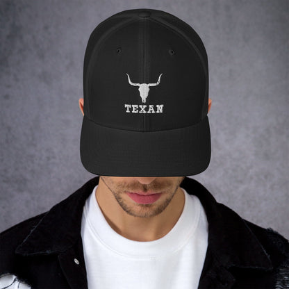 Dark charcoal trucker hat with light gray bull and "TEXAN" embroidery