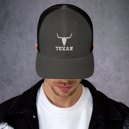 Black trucker hat with light gray bull and "TEXAN" embroidery