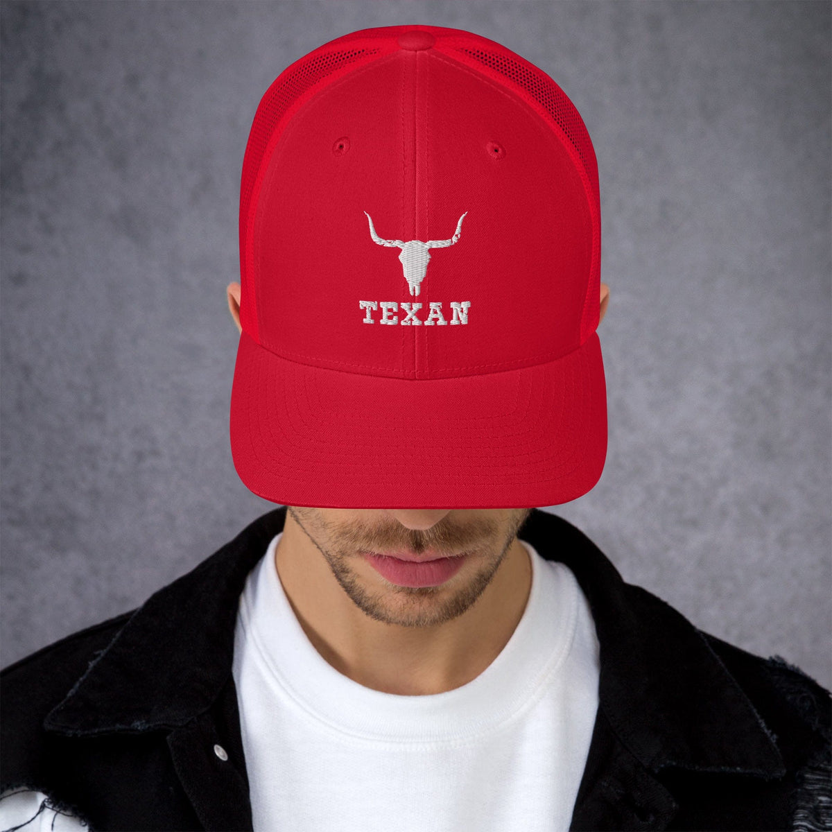 Red trucker hat with white bull and "TEXAN" embroidery