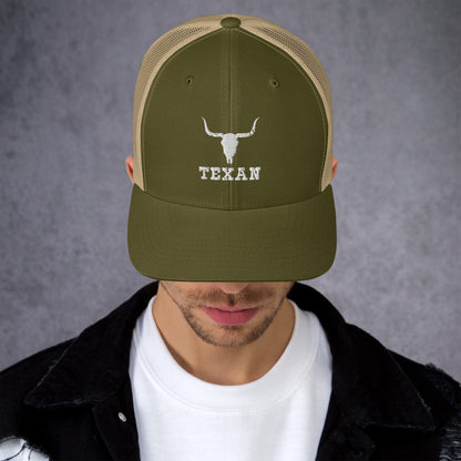 Olive green trucker hat with tan bull and "TEXAN" embroidery