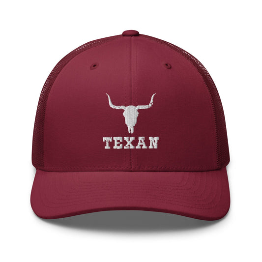Burgundy trucker hat with white bull and "TEXAN" front embroidery
