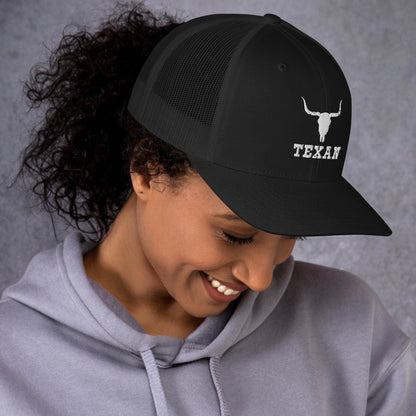 Black trucker hat with white bull and TEXAN logo, curved brim and mesh sides