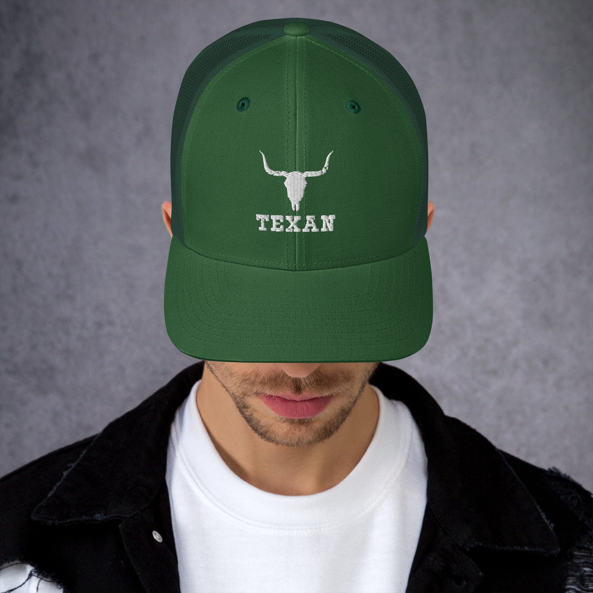 Green trucker hat with light bull and "TEXAN" embroidery