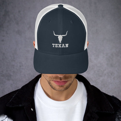 Navy trucker hat with white bull and "TEXAN" embroidery