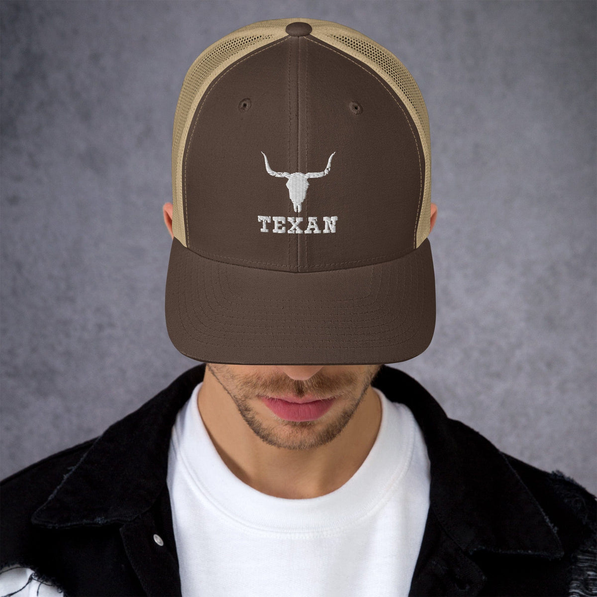 Brown and khaki trucker hat with white bull and "TEXAN" embroidery
