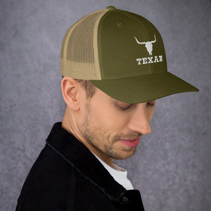 Two-tone trucker hat with olive front and tan mesh sides, longhorn and “TEXAN” logo