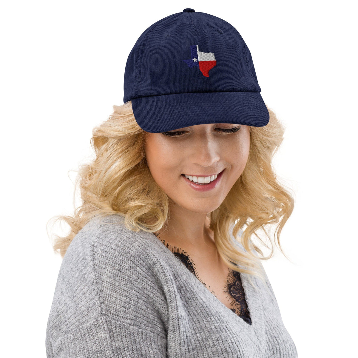 Blue corduroy baseball cap with embroidered Texas map patch at crown.