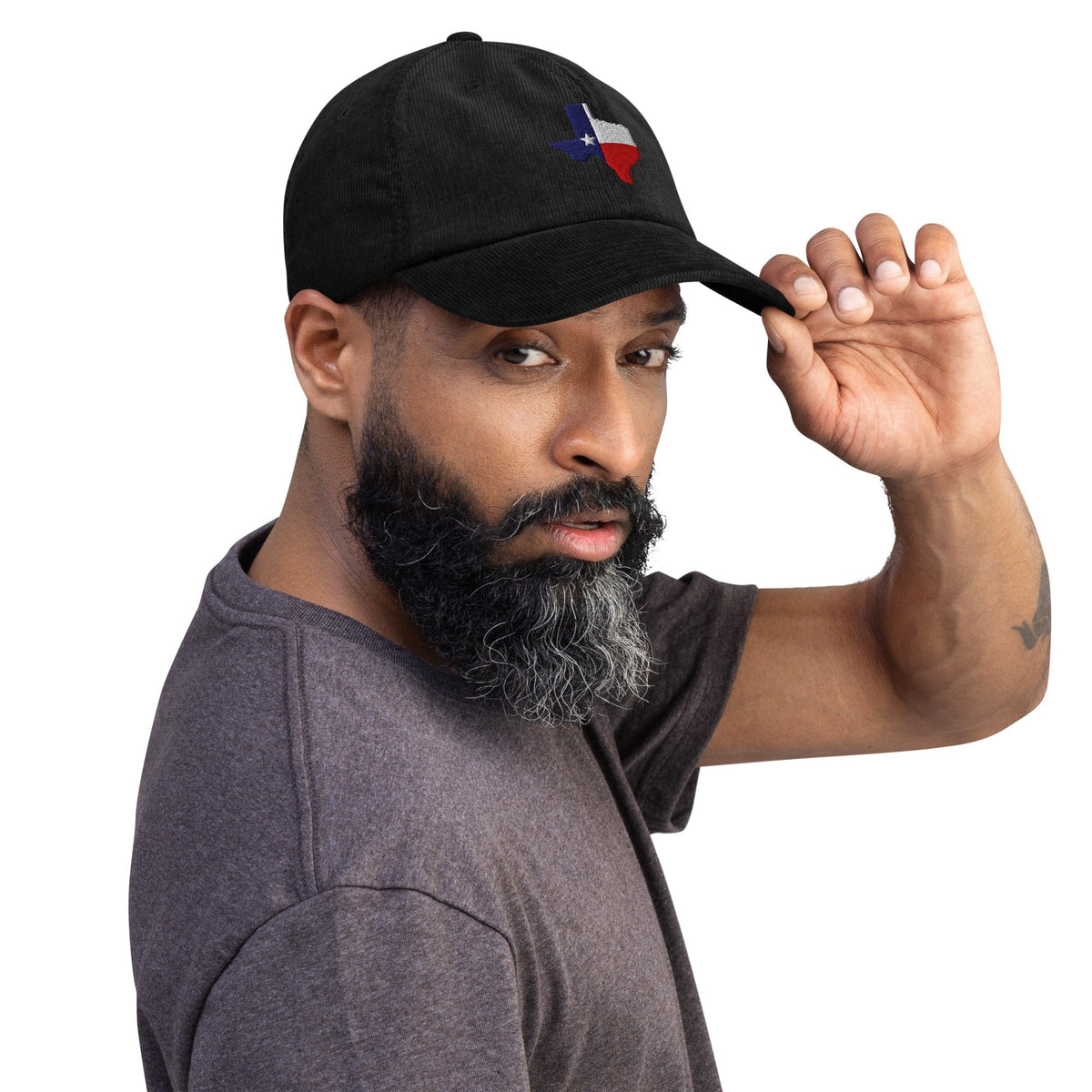 Black corduroy baseball cap with embroidered Texas map patch on front.