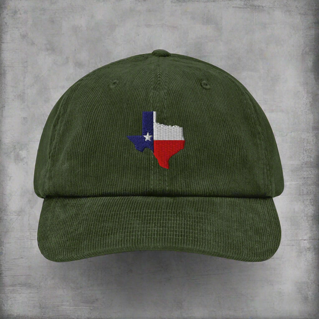 Green corduroy baseball cap with embroidered Texas map patch on front.