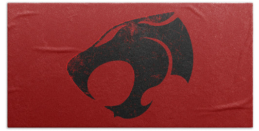 Red beach towel with distressed black Thundercats emblem print