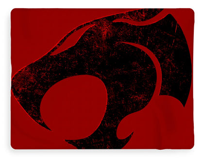 Red blanket with large distressed black Thundercats cat-face graphic