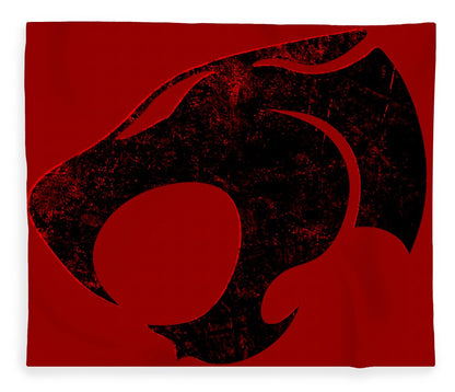 Red blanket with distressed black Thundercats cat-face graphic