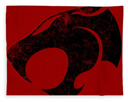 Red blanket with distressed black Thundercats cat-face graphic, centered