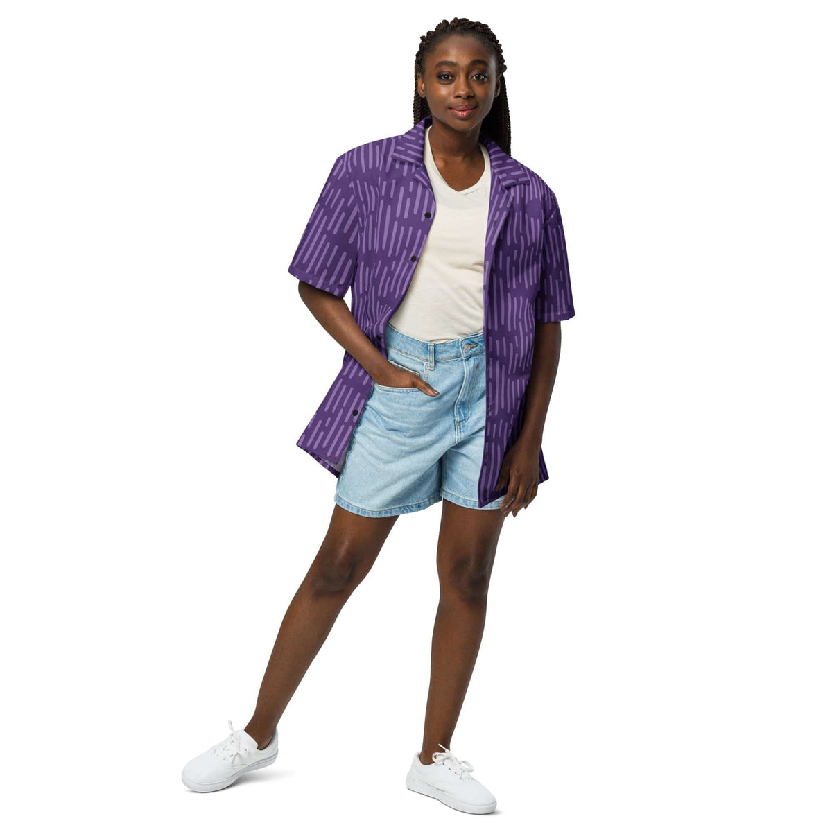Purple patterned button-up short-sleeve shirt worn over light shirt, open front