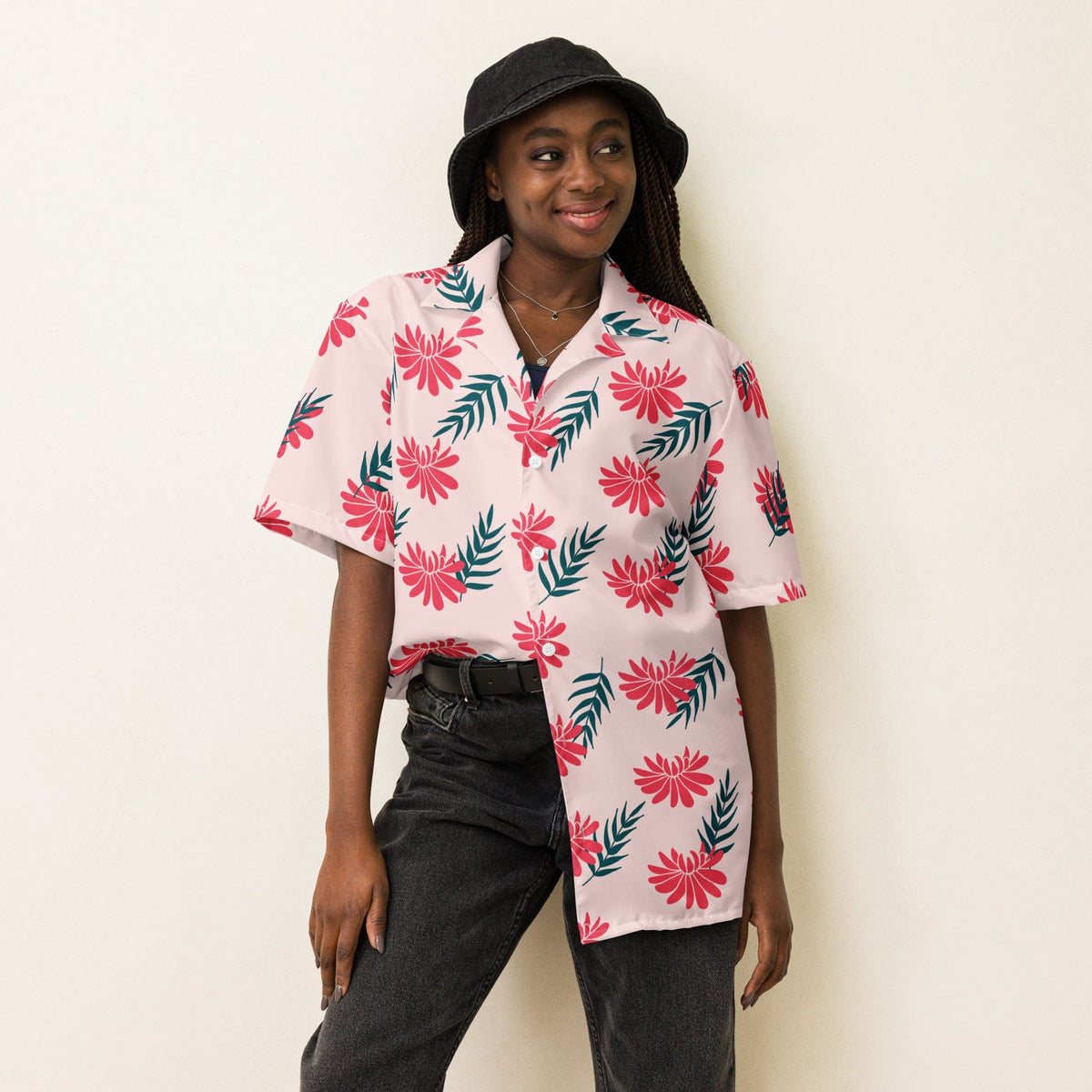 Light pink tropical print short-sleeve shirt with red flowers and green leaf accents.