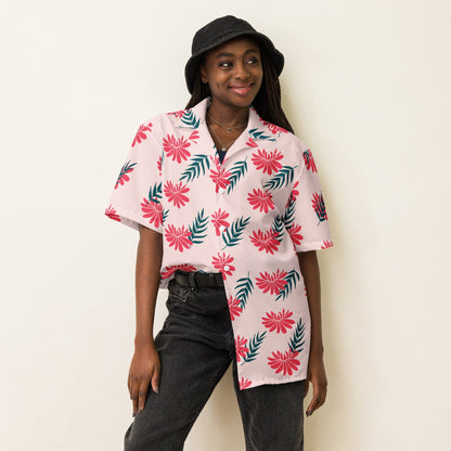 Light pink tropical print short-sleeve shirt with red flowers and green leaf accents.