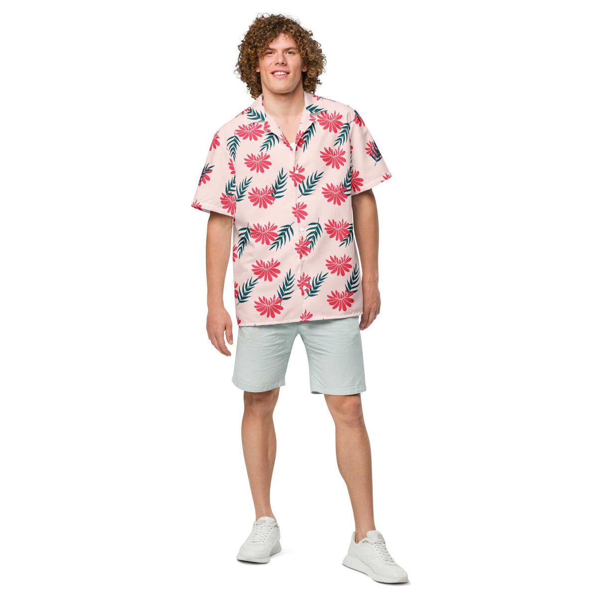 Short-sleeve tropical shirt in light pink with red blossoms and green foliage pattern.