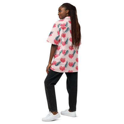 Pink tropical print short-sleeve shirt with red flowers and green leaves on the back.
