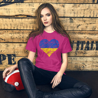 Magenta T-shirt with heart graphic in blue and yellow at center chest