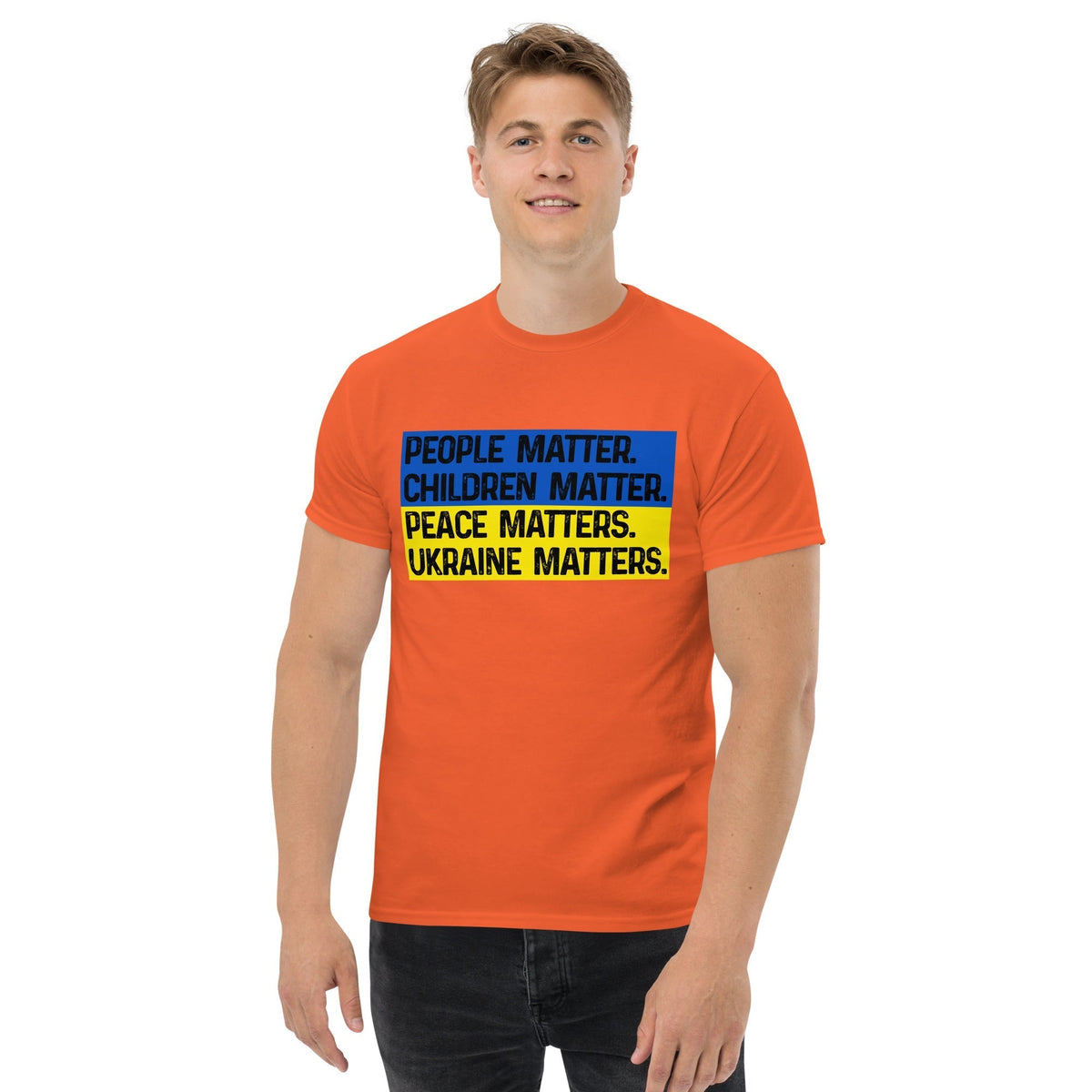 Orange T-shirt with front square text graphic: People Matter, Children Matter, Peace, Ukraine Matters.