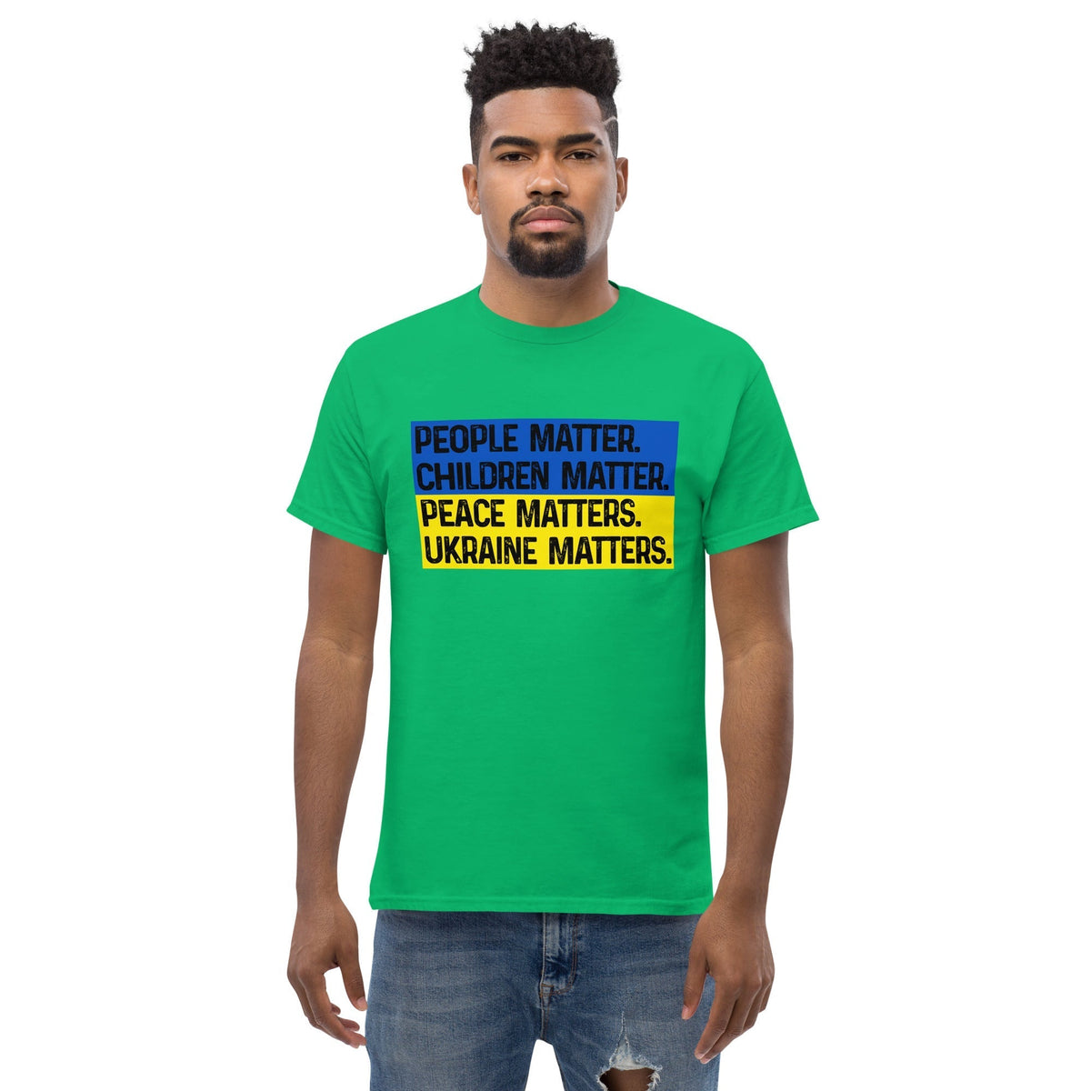 Green T-shirt with front square text graphic: People Matter, Children Matter, Peace, Ukraine Matters.