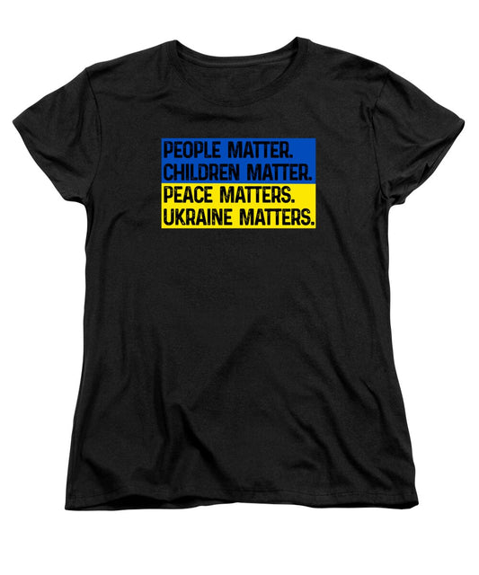 Women's black crewneck T-shirt with bold text graphic: PEOPLE, CHILDREN, PEACE, UKRAINE MATTERS