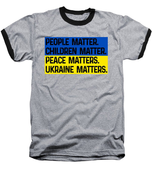 Baseball T-shirt in heather gray with black raglan sleeves; 'Ukraine Matters' text