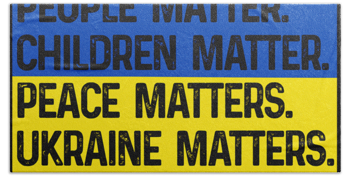 Bath towel with bold slogan text over blue top and yellow middle: UKRAINE MATTERS