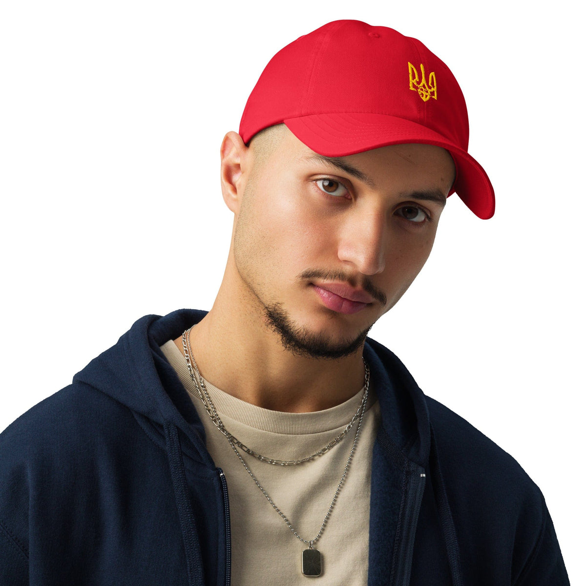 Red Under Armour® cap with yellow Ukrainian trident emblem, worn front angle