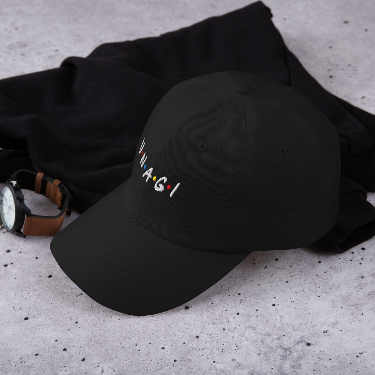 Black embroidered cap with V.N.A.G.I logo on front, curved brim and crown seams