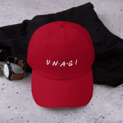 Red embroidered baseball cap with UNAGI logo stitching on front