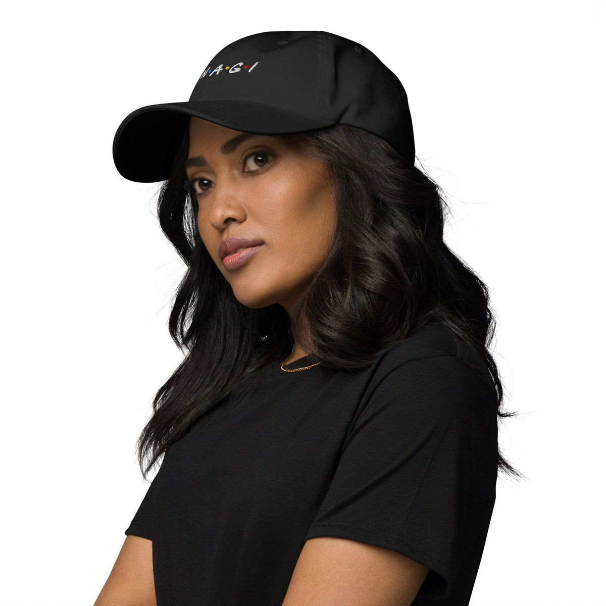 Black embroidered baseball cap worn by model, UNAGI logo on front