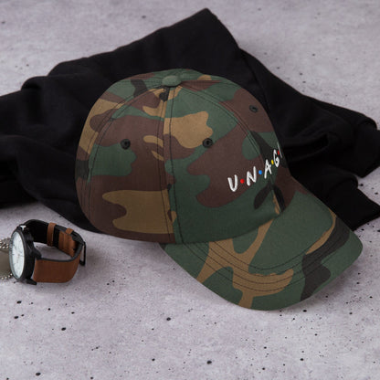 Embroidered baseball cap in camo green-brown with curved brim and front logo