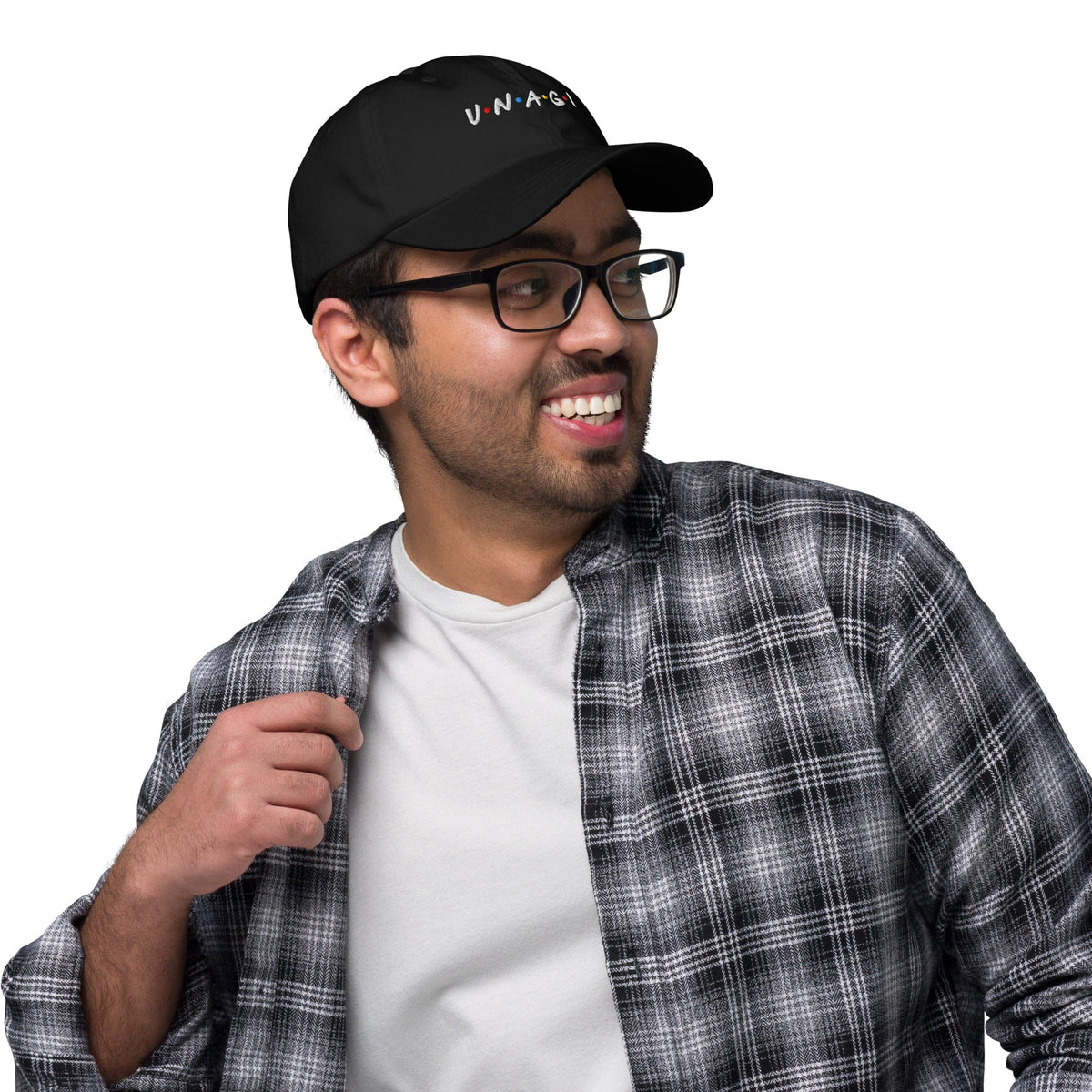 Black embroidered baseball cap worn by man, UNAGI logo on front