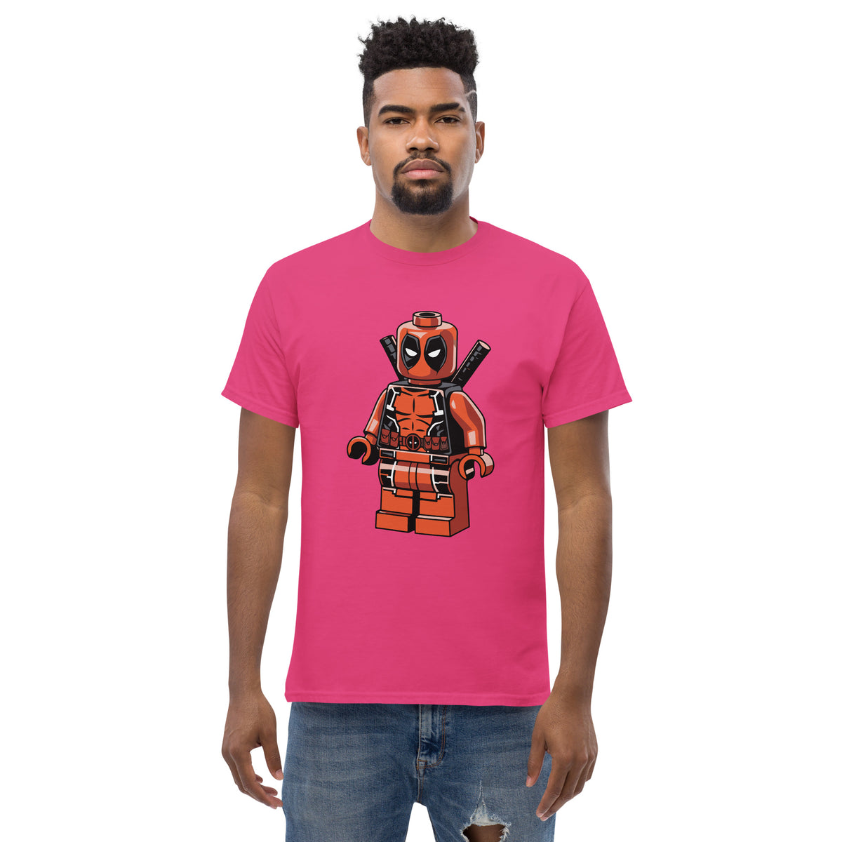 Pink T-shirt with orange-red block superhero character graphic on front
