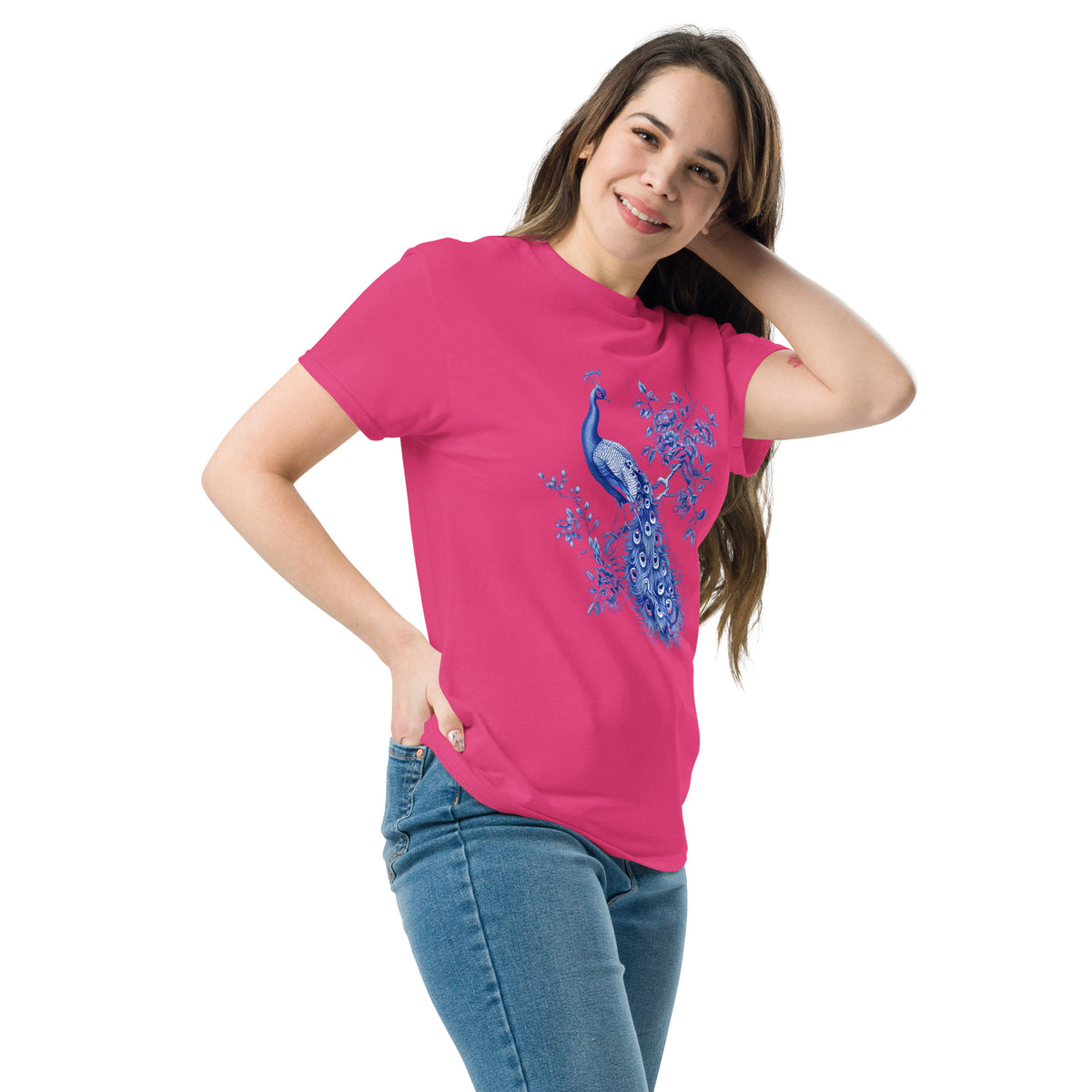Pink t-shirt with blue peacock and floral artwork on the chest