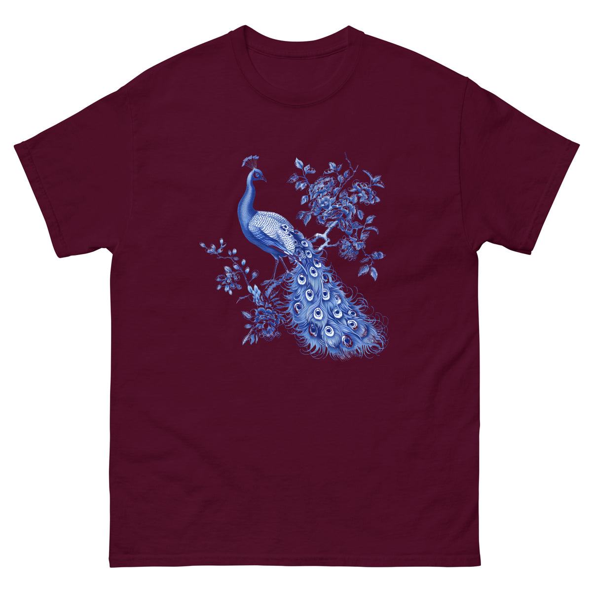 Maroon t-shirt with blue peacock and floral artwork centered on the chest
