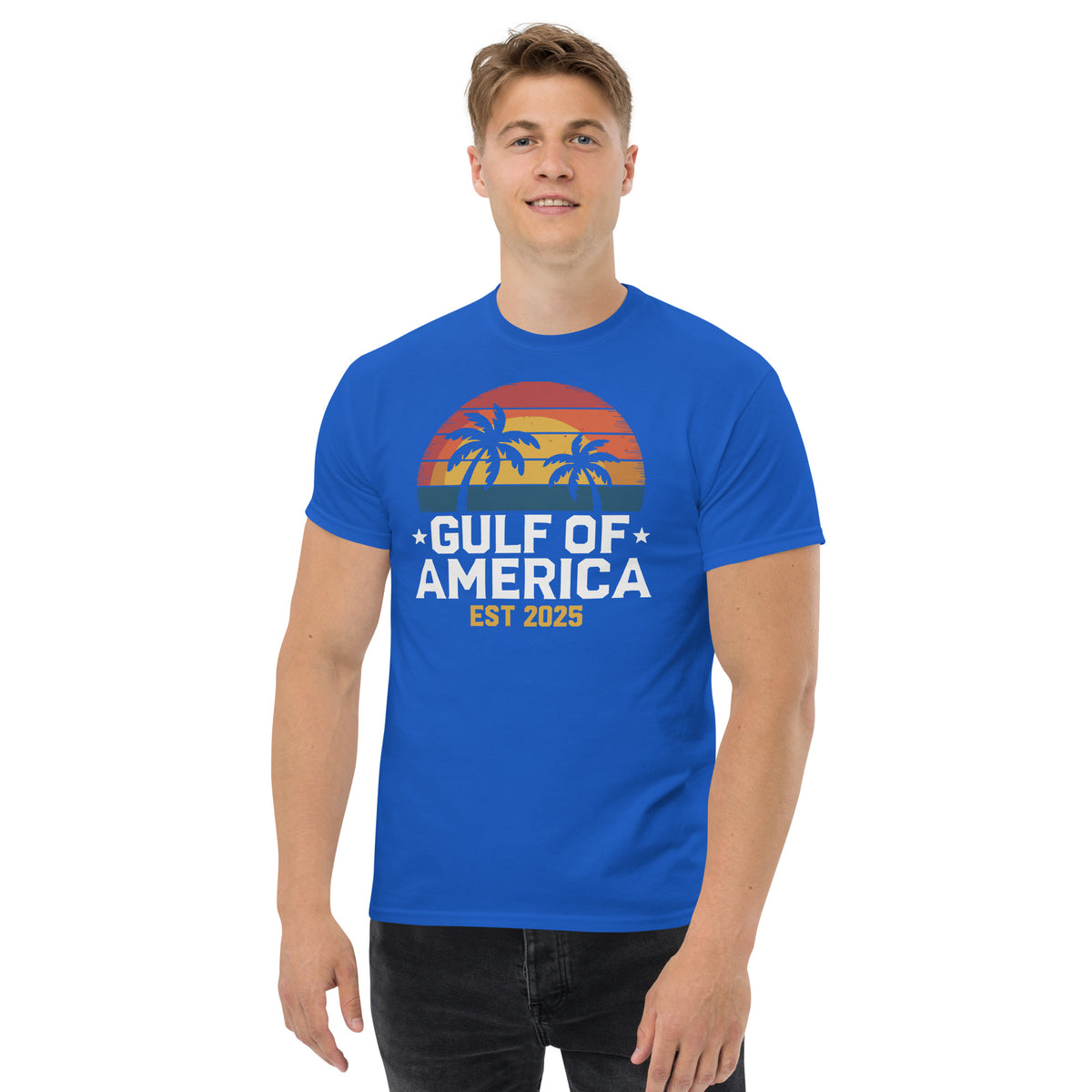 Royal blue crew-neck T-shirt with sunset palm tree graphic and “GULF OF AMERICA EST 2025” print
