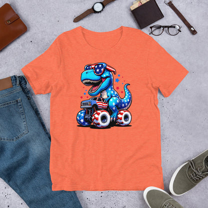 Orange T-shirt with graphic of a roaring T-rex riding a monster truck