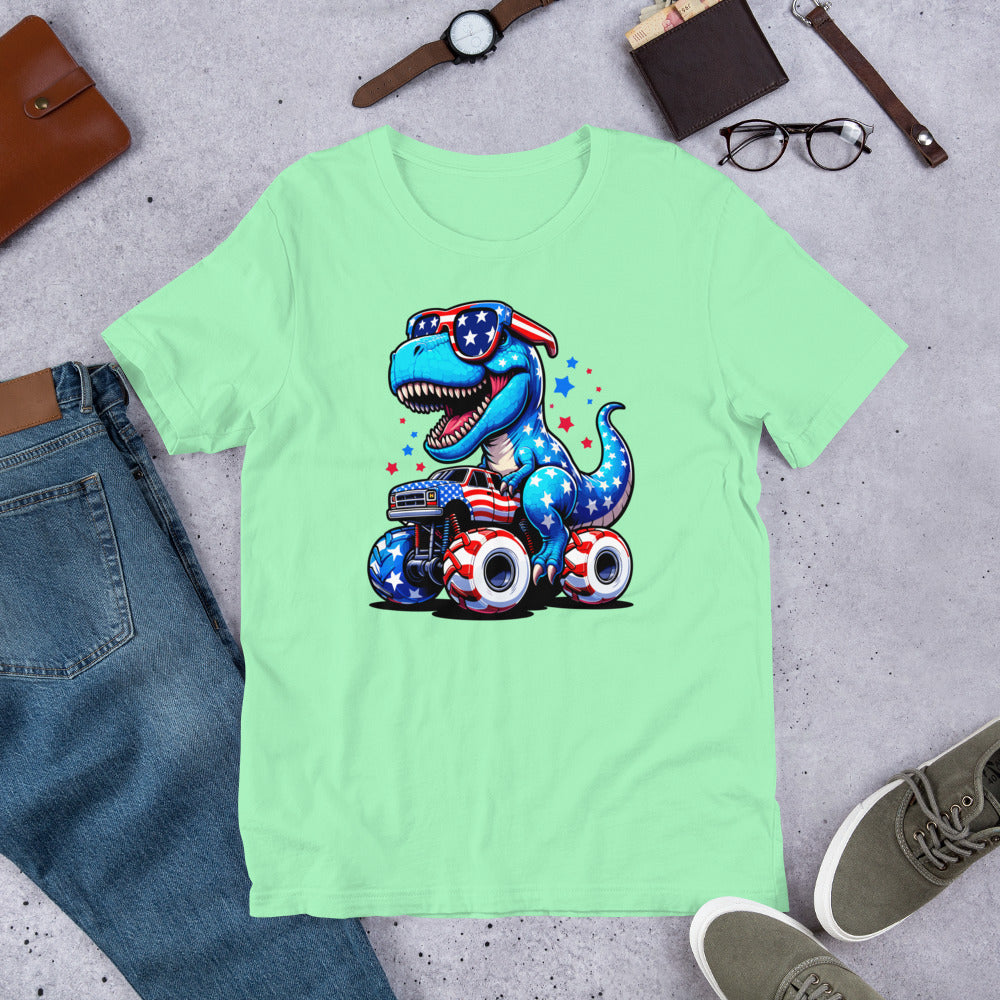 Light green T-shirt with graphic of a roaring T-rex riding a monster truck