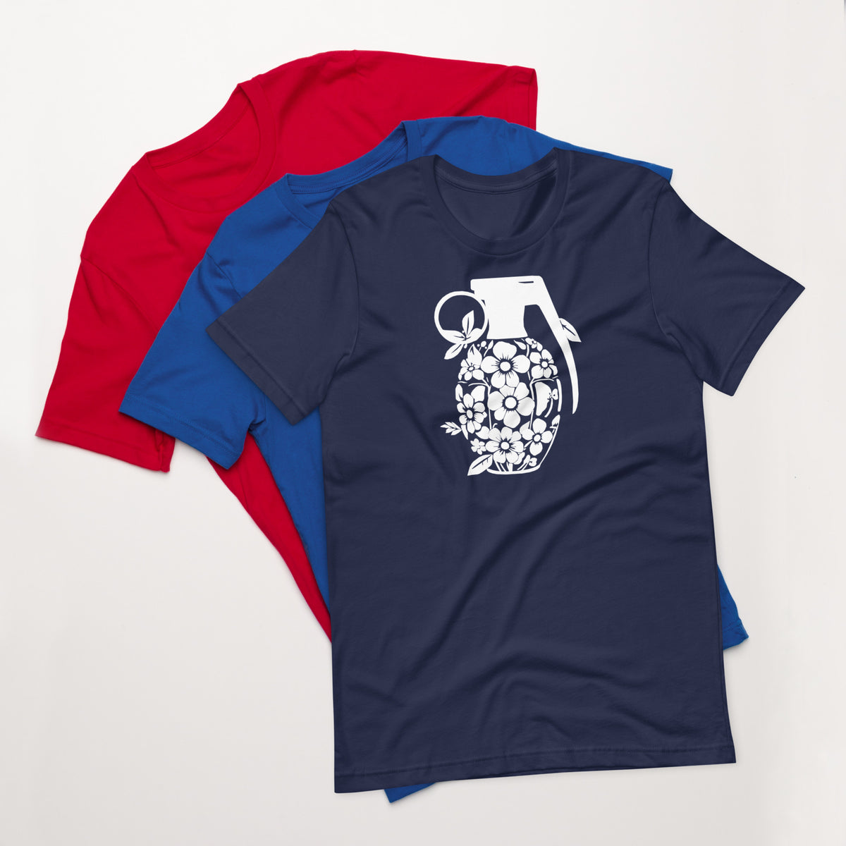 Navy crew-neck T-shirt with white floral grenade graphic on the front; red tee behind.