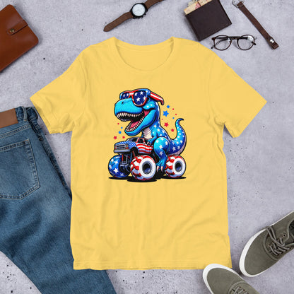 Yellow T-shirt with graphic of a roaring T-rex riding a monster truck