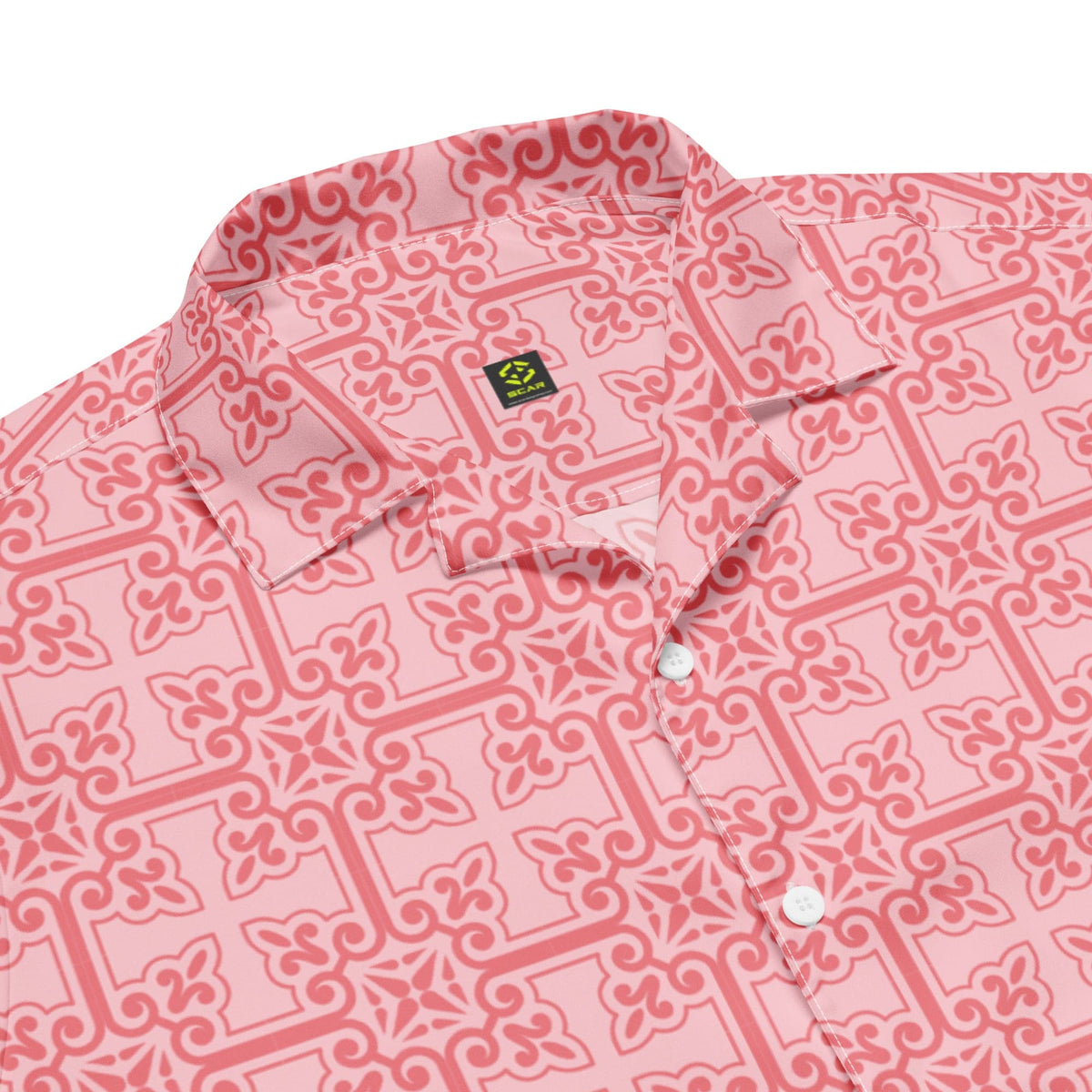 Pink button-up shirt close-up: geometric pattern and chest patch pocket with buttons.