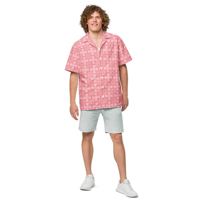 Pink patterned button-up shirt worn with light shorts; short sleeves and button front.